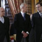 El presidente del Gobierno, Mariano Rajoy y los ministros de Defensa, Pedro Morenés; e Interior, Jorge Fernández Díaz, durante la celebración de la Pascua Militar que Felipe VI preside por vez primera, esta mañana en el Palacio Real.