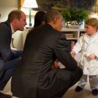 President Barack Obama with First Lady Michelle Obama meets Prince George as the Duke and Duchess of Cambridge watch at Kensington Palace in London, April 22, 2016. (Official White House Photo by Pete Souza)