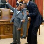 Dec. 4, 2015 "The President acquiesced to a selfie with 11-year-old Jacob Haynes and four-year-old James Haynes after taking a family photograph with departing White House staffer Heather Foster." (Official White House Photo by Pete Souza)
