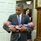 June 17, 2015 "The President carries the twin boys of Katie Beirne Fallon, Director of Legislative Affairs, into the Oval Office just a few months after they were born." (Official White House Photo by Pete Souza)