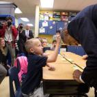 President Barack Obama allows first grader Edwin Caleb to touch his hair during a classroom visit at Clarence Tinker Elementary School at MacDill Air Force Base in Tampa, Fla., Sept. 17, 2014. (Official White House Photo by Lawrence Jackson)