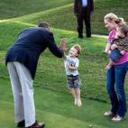 President Barack Obama greets a child on the Kingsmill Resort grounds during a break from debate prep in Williamsburg, Va., Oct. 14, 2012. (Official White House Photo by Pete Souza)