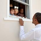 President Barack Obama greets children at a day care facility adjacent to daughter Sasha's school in Bethesda, Md., following her 4th grade closing ceremony, June 9, 2011. (Official White House Photo by Pete Souza)