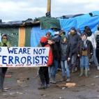 CALAIS, FRANCE - FEBRUARY 29: Refugees protesting face anti-riot policemen during the clearing of Calais refugee camp in the French northern port city of Calais, on February 29, 2016. French authorities have started on Monday morning clearing re...