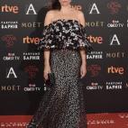 Con clutch de Salvatore Ferragamo