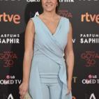 Vestida de LK Bennett y con clutch de Jimmy Choo