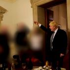 British Prime Minister Boris Johnson gestures in 10 Downing Street during gathering on the departure of a special adviser, in London, Britain November 13, 2020 in this picture obtained from civil servant Sue Gray's report published on May 25, 20...