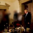 British Prime Minister Boris Johnson gestures in 10 Downing Street during gathering on the departure of a special adviser, in London, Britain November 13, 2020 in this picture obtained from civil servant Sue Gray's report published on May 25, 20...