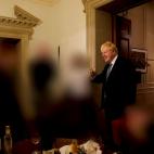 British Prime Minister Boris Johnson gestures in 10 Downing Street during gathering on the departure of a special adviser, in London, Britain November 13, 2020 in this picture obtained from civil servant Sue Gray's report published on May 25, 20...