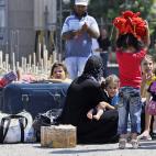 Refugiados sirios llegan al cruce fronterizo de Cilvegozu, en Turquía, el lunes 2 de septiembre de 2013. (Foto AP/Gregorio Borgia)