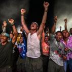 Miembros de las Fuerzas Armadas Revolucionarias de Colombia (las FARC) bailan durante un festival cultural en su campamento en Llanos del Yari, en el departamento de Caqueta (Colombia), el 21 de septiembre.