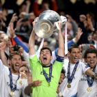 Real Madrid goalkeeper and captain Iker Casillas lifts the UEFA Champions League trophy