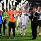 Real Madrid manager Carlo Ancelotti (right) and assistant head coach Paul Clement (left) celebrate with the UEFA Champions League Trophy