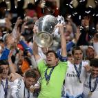 Real Madrid goalkeeper and captain Iker Casillas lifts the UEFA Champions League trophy