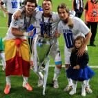 Real Madrid's Pepe (left), Cristiano Ronaldo (centre) and Fabio Coentrao celebrate with the UEFA Champions League Trophy after the UEFA Champions League Final at at the Estadio da Luiz, Lisbon, Portugal.
