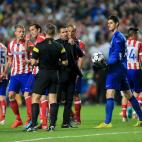 Atletico Madrid manager Diego Simeone speaks with match referee Bjorn Kuipers