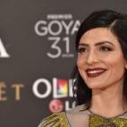 Primer plano de la actriz que lució pendientes de inspiración art decó.