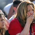 Una mujer reacciona ante lo ocurrido.
