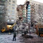 MAGNITOGORSK, RUSSIA - DECEMBER 31, 2018: Clearing the debris at the site of an apartment building collapse. A suspected domestic gas blast caused a partial collapse of a residential building at 164 Karla Marksa Prospekt Street killing three peo...