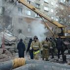 MAGNITOGORSK, RUSSIA - DECEMBER 31, 2018: Clearing the debris at the site of an apartment building collapse. A suspected domestic gas blast caused a partial collapse of a residential building at 164 Karla Marksa Prospekt Street killing three peo...