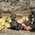 La magnitud de la cat&aacute;strofe es tal, que se han tenido que enterrar a las v&iacute;ctimas en fosas comunes.