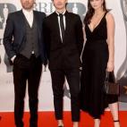 Dave Berry, George Shelley and Lilah Parsons arriving for the 2016 Brit Awards at the O2 Arena, London.Credit: Doug Peters/ EMPICS Entertainment