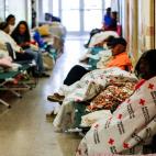 People are seen inside a shelter run by Red Cross before Hurricane Florence comes ashore in Grantsboro, North Carolina, U.S., September 13, 2018. REUTERS/Eduardo Munoz
