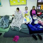 People are seen inside a shelter run by Red Cross before Hurricane Florence comes ashore in Grantsboro, North Carolina, U.S., September 13, 2018. REUTERS/Eduardo Munoz