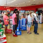 Customers pick up last minute supplies at a convenience mart ahead of the arrival of Hurricane Florence in Myrtle Beach, South Carolina, U.S. September 13, 2018. REUTERS/Randall Hill