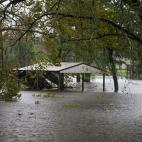 Flood waters from the Trent River inundate a park in Pollocksville, North Carolina on September 14, 2018 during Hurricane Florence. - Florence smashed into the US East Coast Friday with howling winds, torrential rains and life-threatening storm ...