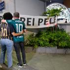 Football fans stand in front of a banner reading "Eternal King Pele" outside the Albert Einstein Israelite Hospital, where the Brazilian football legend died after a long battle with cancer, in Sao Paulo, Brazil, on December 29, 2022. - Brazilia...