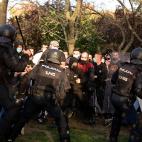Police clash with people during a demonstration against a political rally of far-right party Vox ahead of regional elections in Madrid's suburb of Vallecas on April 7, 2021. (Photo by JAVIER SORIANO / AFP) (Photo by JAVIER SORIANO/AFP via Getty ...