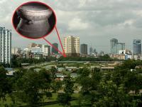 Una imagen de archivo del skyline de Vietnam y otra de un tambor Dong Son