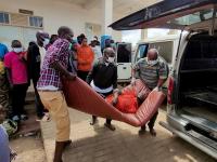 A man is carried from an ambulance as he arrives at Bunia General Referral Hospital following confirmation of an Ebola outbreak involving the Bundibugyo strain in Bunia, Ituri province, Democratic Republic of Congo, May 16, 2026.  Picture taken with a mobile phone. REUTERS/Victoire Mukenge