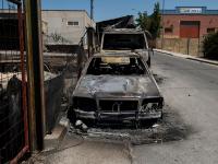 Varios coches quemados en los incendios de Madrid.