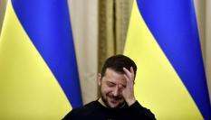 El presidente ucraniano, Volodímir Zelenski, riéndose.