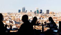 Social gathering in Madrid center with the views of the business district of Madrid. Spain.