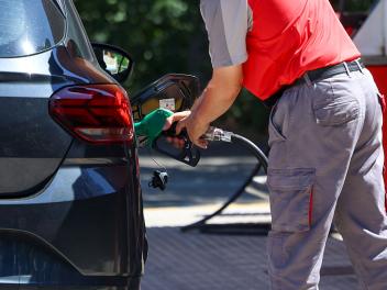 MADRID, SPAIN - JULY 01: A person is filling up a car with petrol at a petrol station on 1 July 2026 in Madrid, Spain. The CNMC (National Commission for Markets and Competition) is today publishing a list of petrol stations that are taking advantage of state aid to increase their profits, with the aim that this “public naming and shaming” will also serve as a basis for consumers to lodge complaints under the reform of Royal Decree-Law 7/2026, which comes into force today and was approved by the Council of Ministers to tighten control over the fuel market. (Photo By Marta Fernandez/Europa Press via Getty Images)