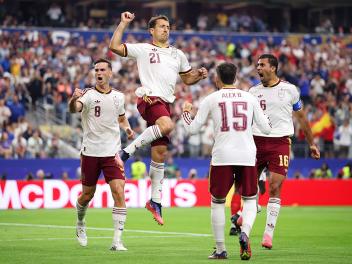 ARLINGTON, TEXAS - JULY 14: Mikel Oyarzabal #21 of Spain celebrates with teammates after converting a penalty to score the team's first goal during the FIFA World Cup 2026 Semi Final match between France and Spain at Dallas Stadium on July 14, 2026 in Arlington, Texas. (Photo by Hector Vivas - FIFA/FIFA via Getty Images)