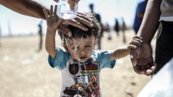 Las duras imágenes de 60.000 kurdos cruzando la frontera con Turquía (FOTOS)