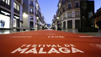 Malaga, Andalusia, Spain - March 1, 2024. A famous street, city promenade, Larios Street in Malaga with the Festival de Málaga logo on the red carpet to promote the annual film festival with movie screenings and an award ceremony in Malaga. City buildings with shops and restaurants line the beautiful walkway, soon to be filled with celebrities, movie stars, actors, actresses, fans and photographers. The famous event is similar to the Oscars and Cannes Film Festival but it features Spanish language films.