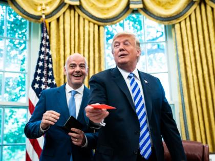 WASHINGTON, DC - AUGUST 28 : President Donald J. Trump is given a red card by FIFA President Gianni Infantino during a meeting in the Oval Office of the White House on Tuesday, Aug 28, 2018 in Washington, DC. (Photo by Jabin Botsford/The Washington Post via Getty Images)