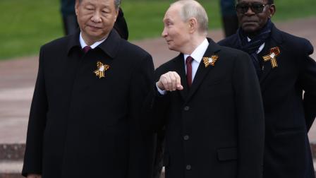 Putin hablando con Xi Jinping