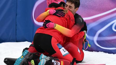 Milano Cortina 2026 Olympics - Ski Mountaineering - Mixed Relay - Stelvio Ski Centre, Bormio, Italy - February 21, 2026. Ana Alonso Rodriguez of Spain and Oriol Cardona Coll of Spain celebrate after winning bronze in the Mixed Relay REUTERS/Angelika Warmuth