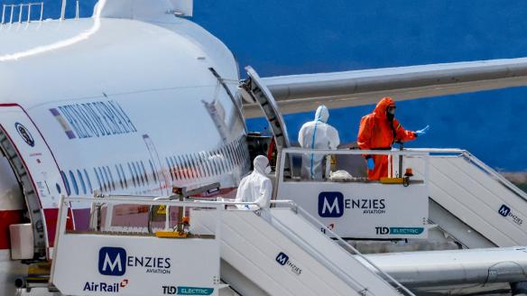 Passengers of the cruise ship MV Hondius, which was affected by a hantavirus outbreak, board a Spanish plane at Tenerife Sud airport, Canary Islands, Spain, May 10, 2026. REUTERS/Borja Suarez