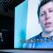 Sam Altman, en una enorme pantalla con subtítulos en japonés