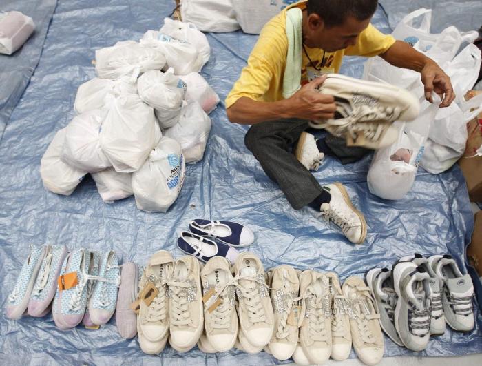 El tifón 'Bopha' deja al menos 238 muertos a su paso por Filipinas (FOTOS)