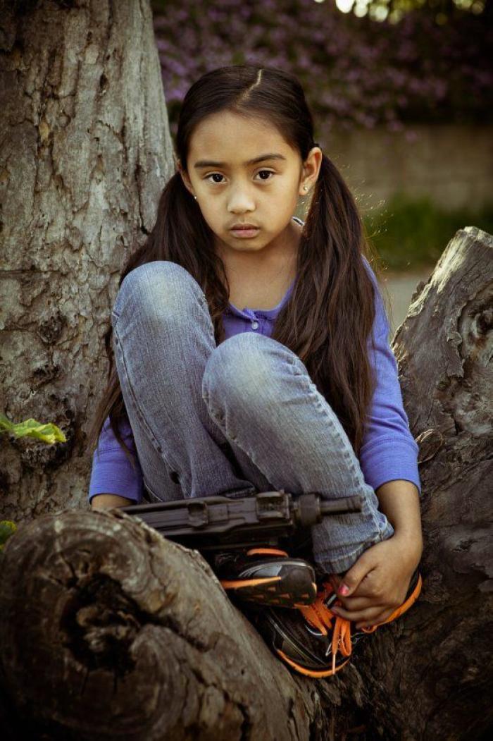 Fotografías de niños de EEUU con armas para denunciar la masacre de Newtown un año después