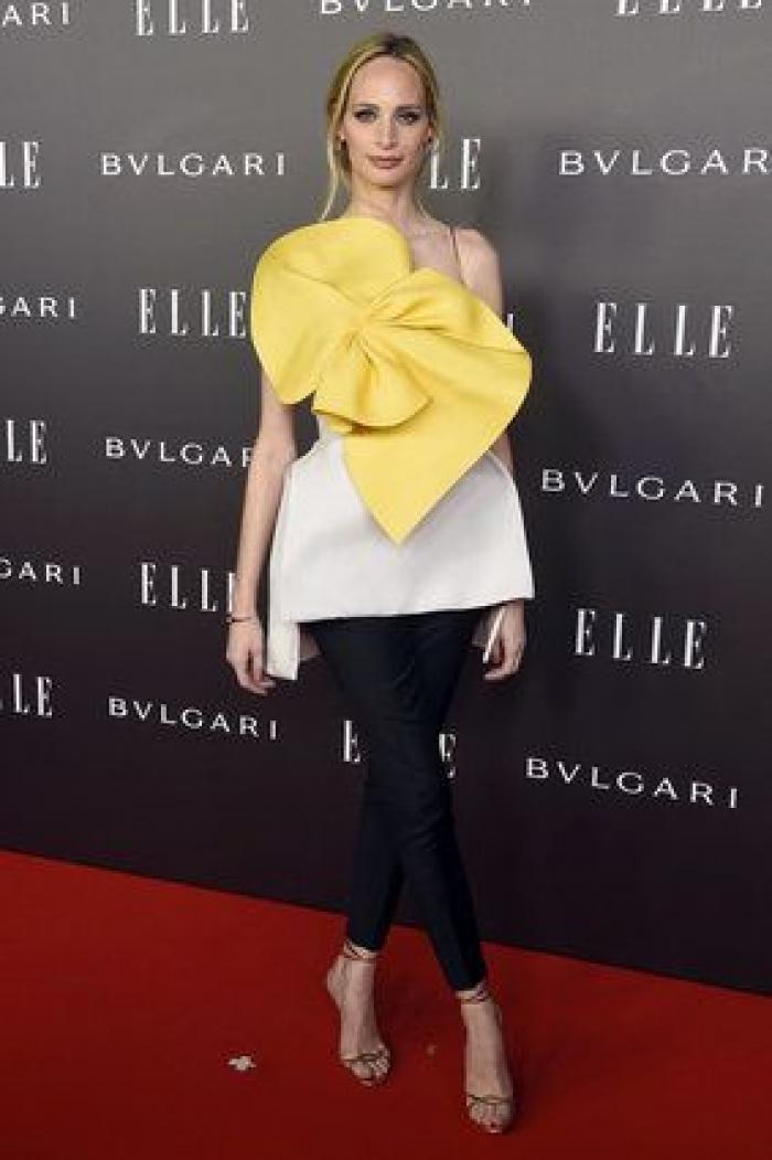 Sara Carbonero enseña pierna, escote y tatuaje en la fiesta Elle (FOTOS)