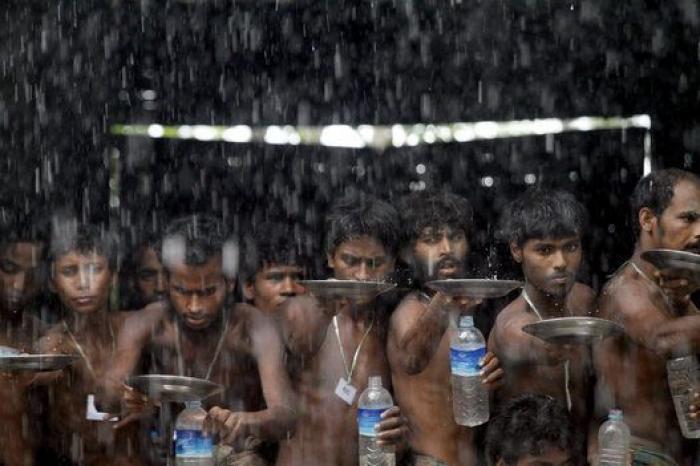 La policía china impidiendo un suicidio, la feria del caballo en Appleby y otras fotos del jueves